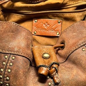 Oil burnished suede shoulder bag with the coordinating wallet.